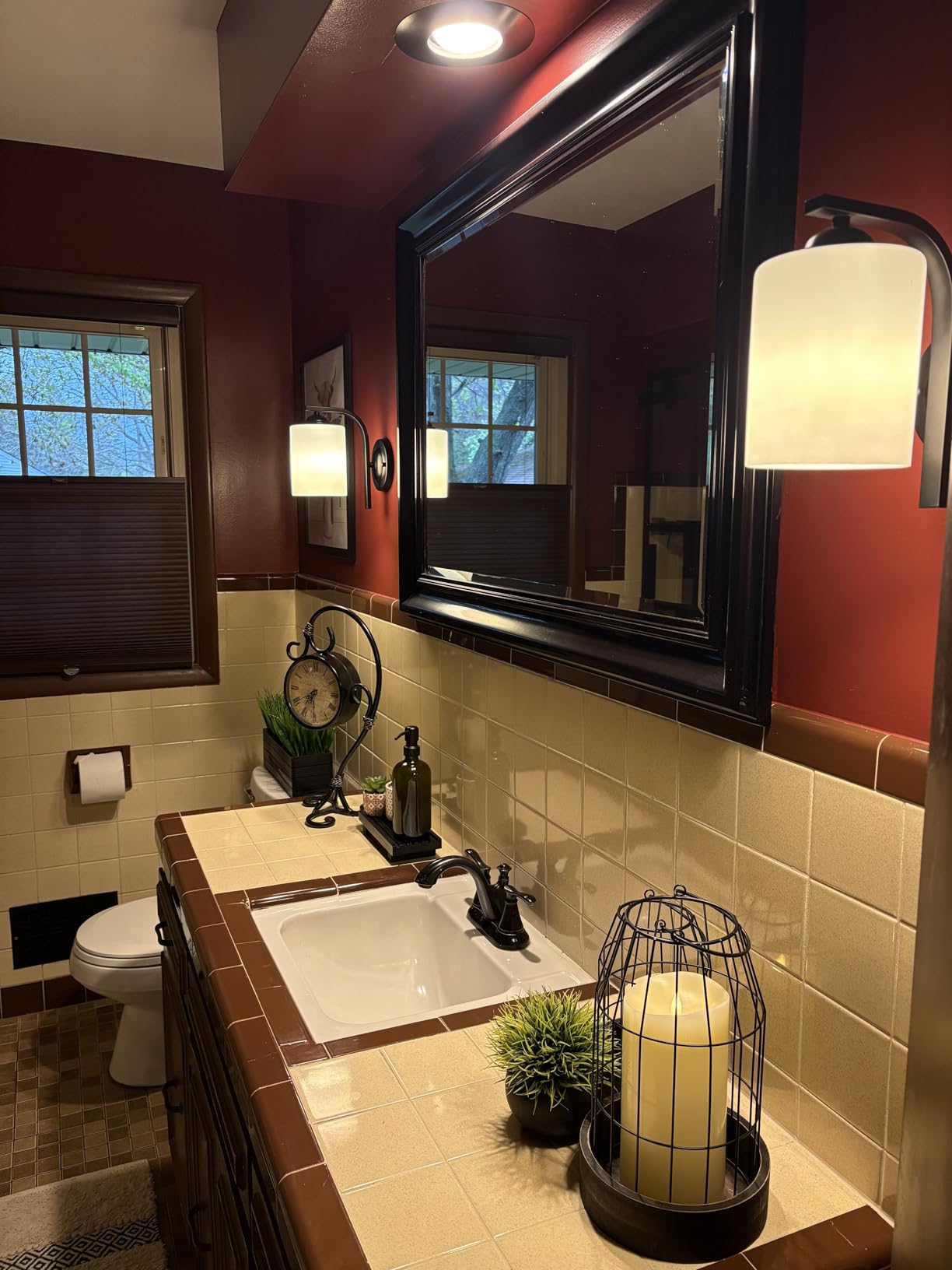 Bathroom with sink, mirror, and decorative elements.
