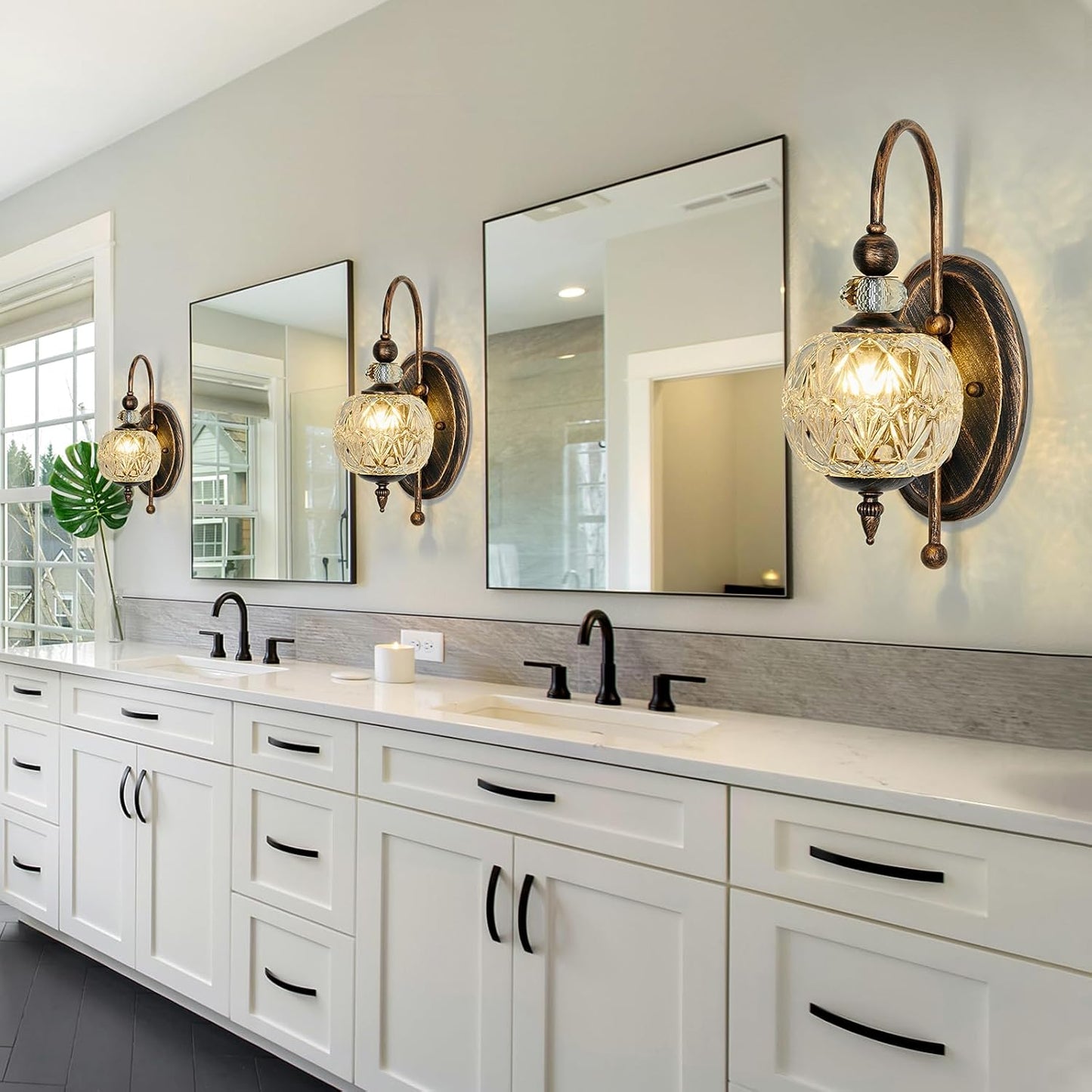 Bathroom vanity with mirrors, lights, and a countertop.