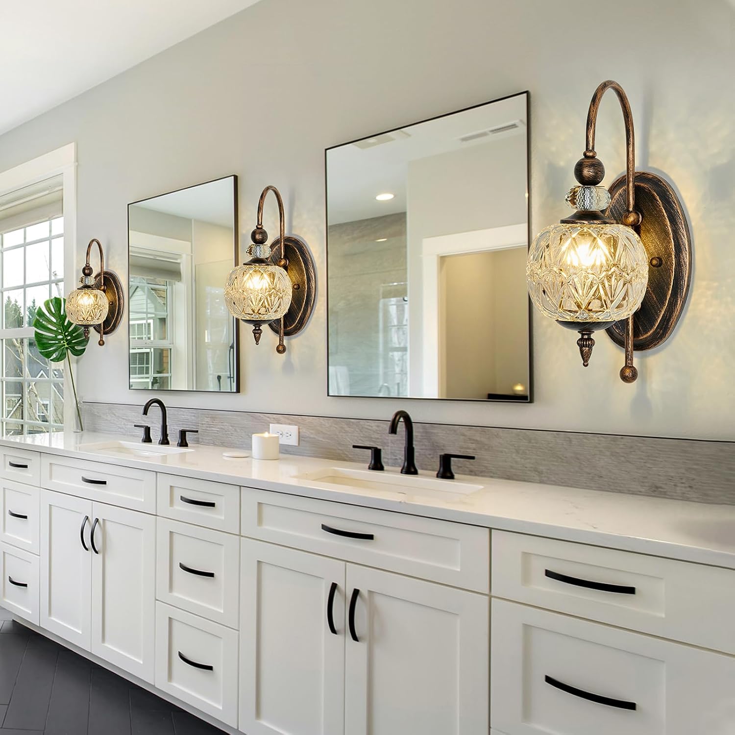 Bathroom vanity with mirrors, lights, and a countertop.