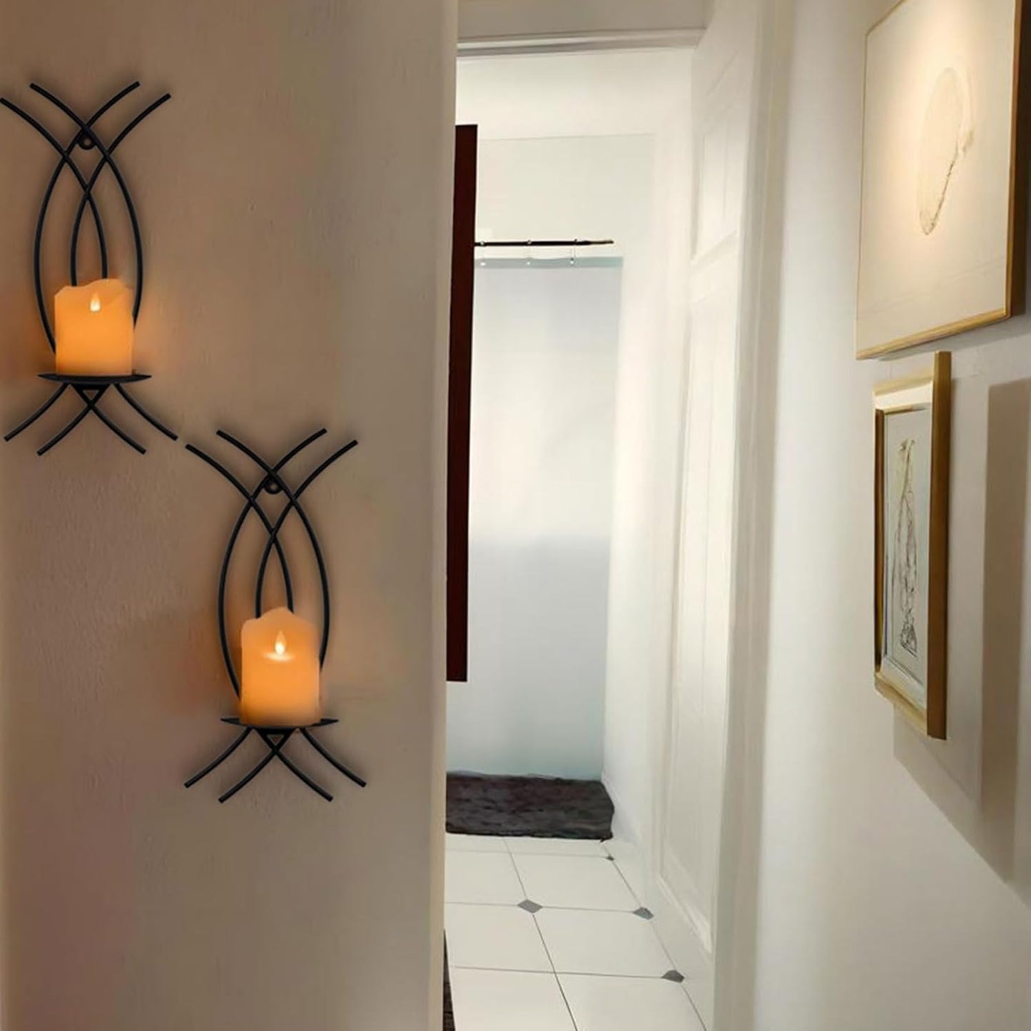 Decorative wall sconces with candles on a white wall in a hallway.