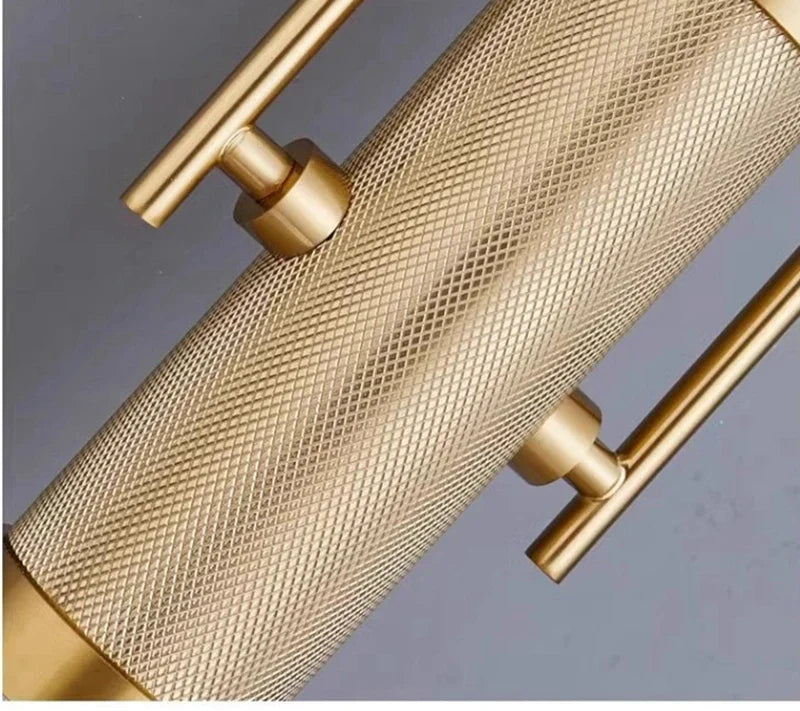 Gold mesh screen with metallic handles on a gray background