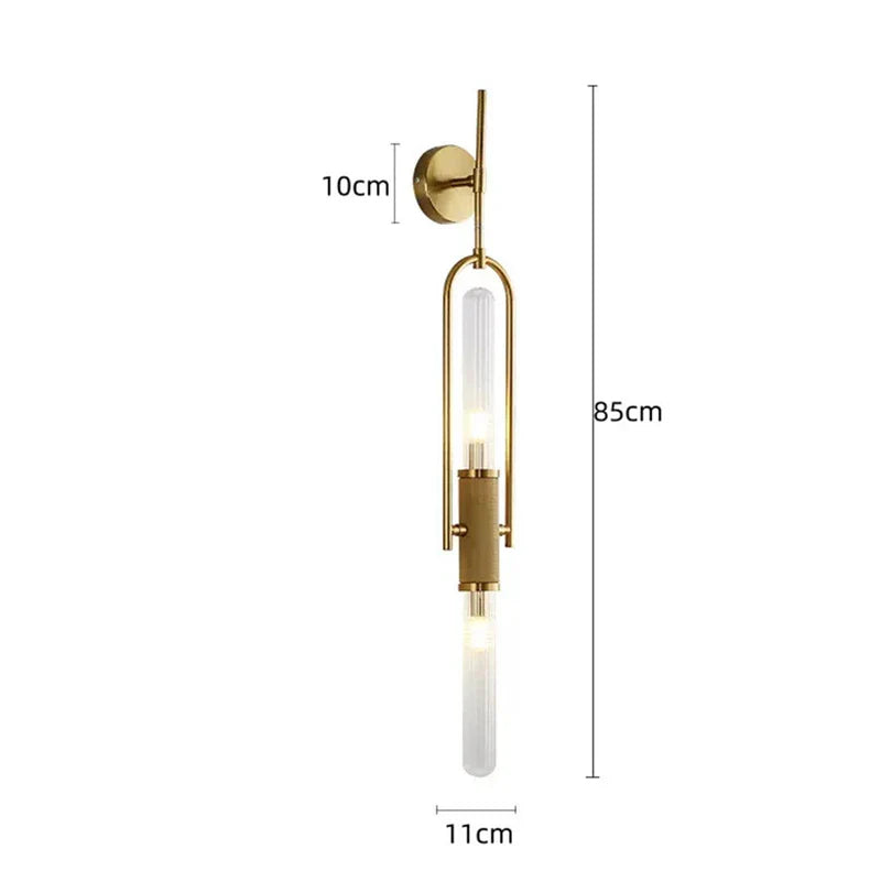 Gold wall-mounted light fixture with measurements on a white background