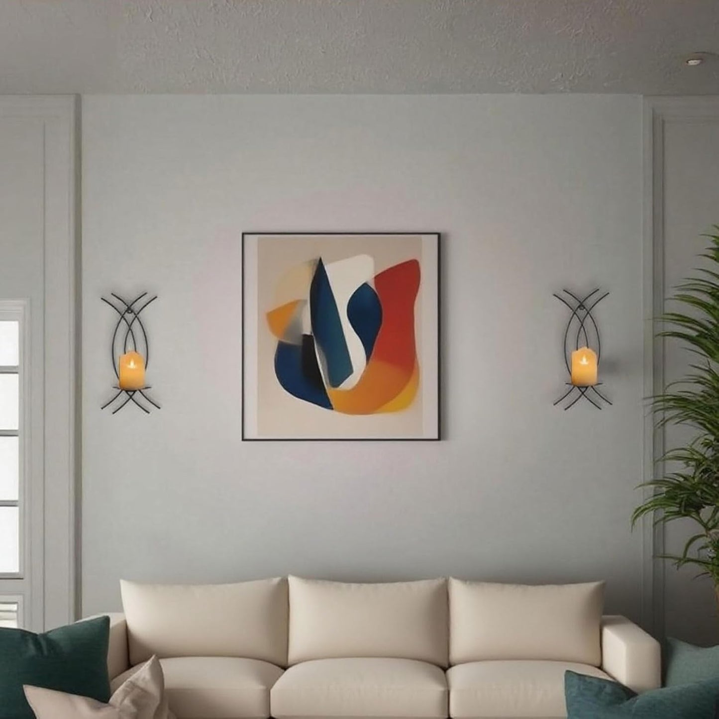 Living room with a beige sofa, abstract art, and wall sconces.