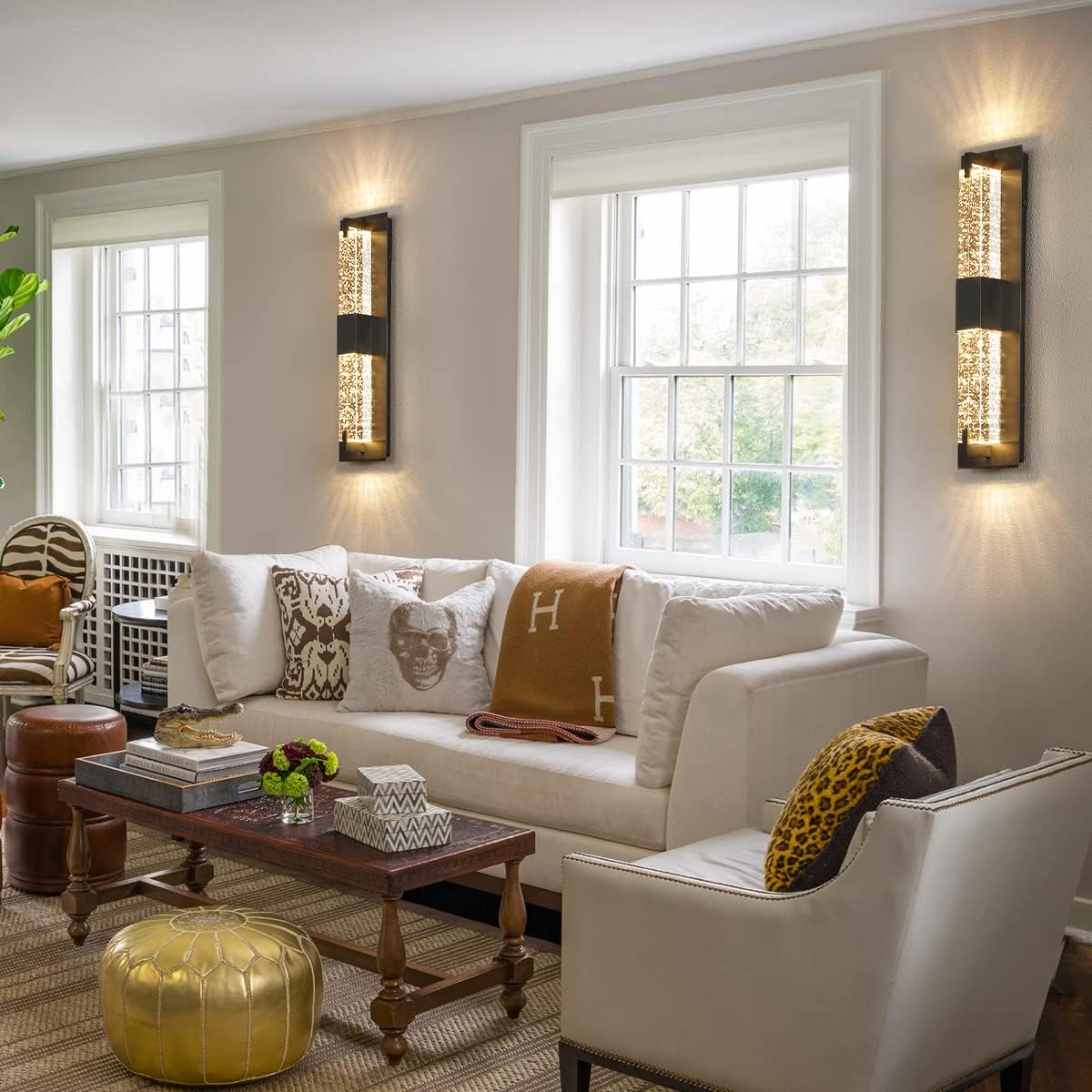 Living room with a white sofa, decorative pillows, and a wooden coffee table.