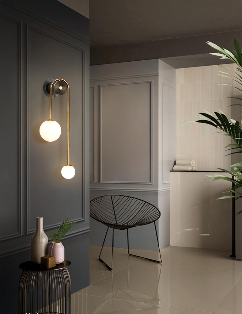 Modern wall sconce in a stylish interior setting with a chair and decor items.