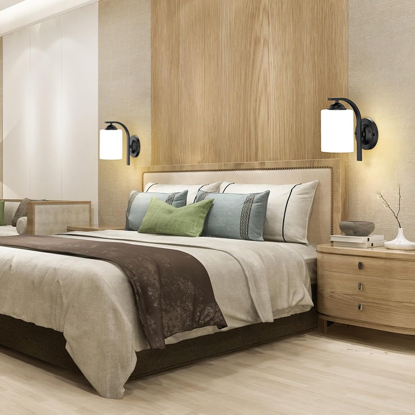 Neatly made bed with decorative pillows in a bedroom setting.