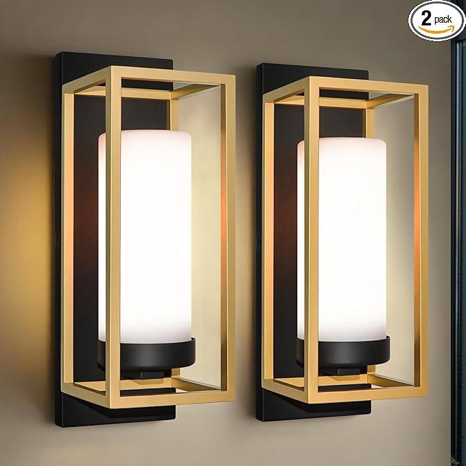 Pair of rectangular outdoor wall lights mounted on a modern exterior wall, glowing at dusk.