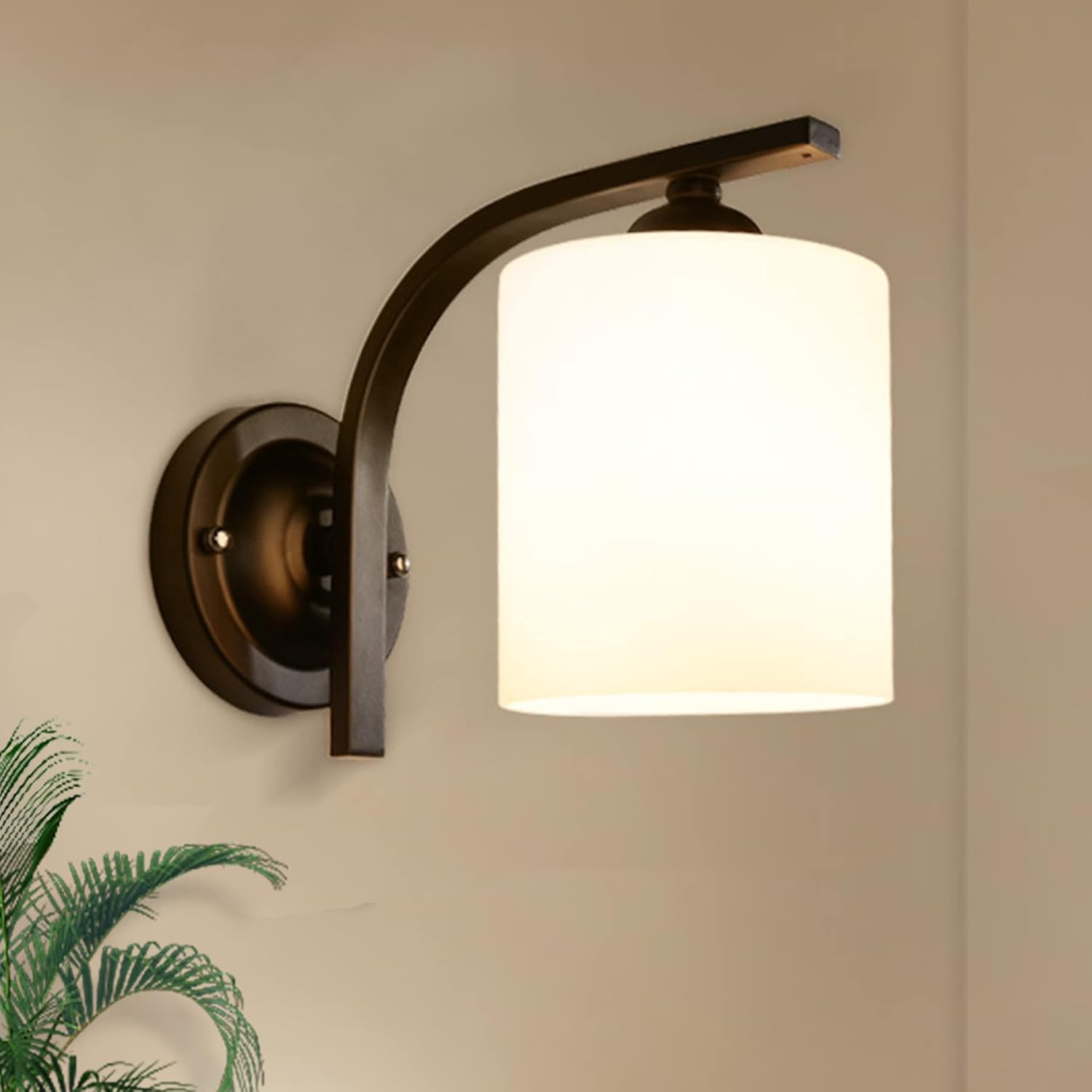 Wall-mounted lamp with white shade and black metal arm on a beige wall.