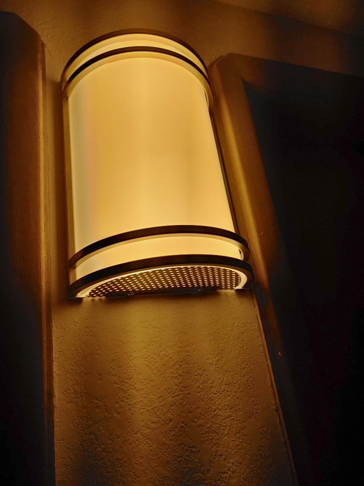 Wall-mounted light fixture on a textured wall